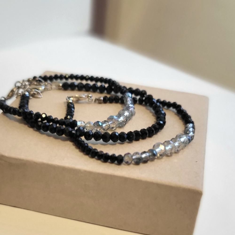 Pair of minimalist black faceted beaded stacking bracelets